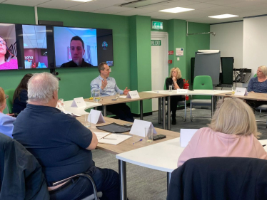 David answers questions at a SOHA tenants roundtable